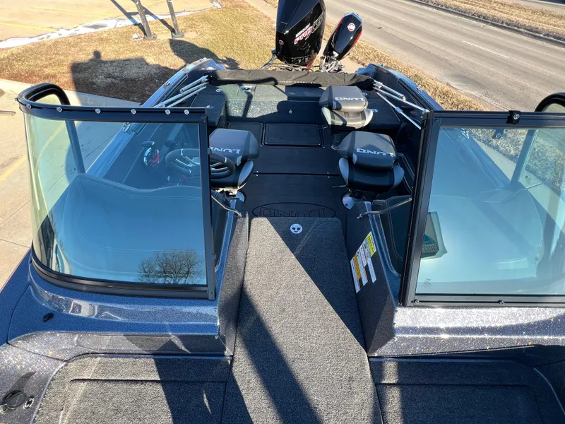 Slide: The Image of 2025 Lund 189 Pro-V GL boat interior with open windshield and seating. - 20