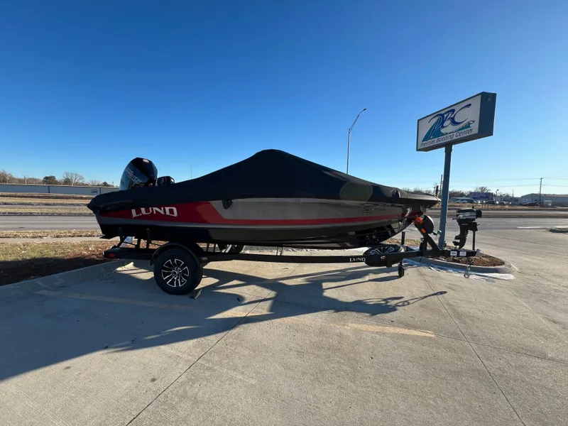Slide: The Image of 2025 Lund 189 Pro-V GL boat on trailer, covered, parked outdoors. - 4