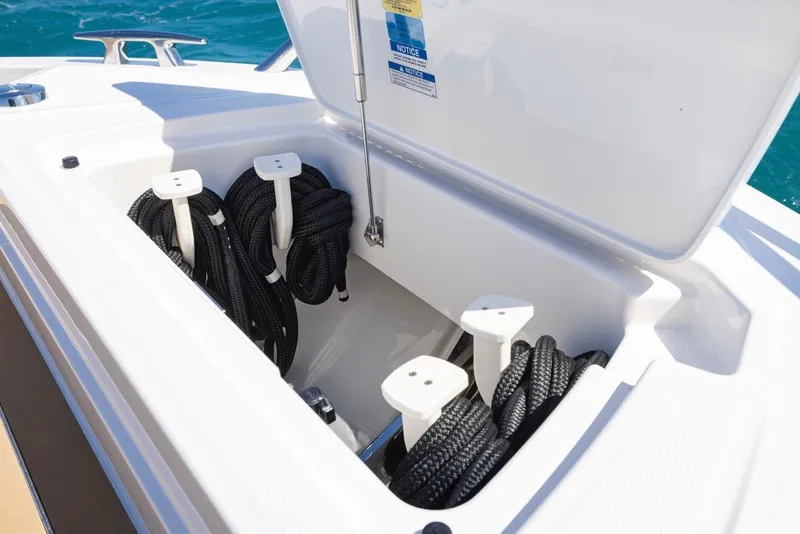 Slide: The Image of Storage compartment with ropes on the 2025 Tiara Yachts EX 54 boat. - 13