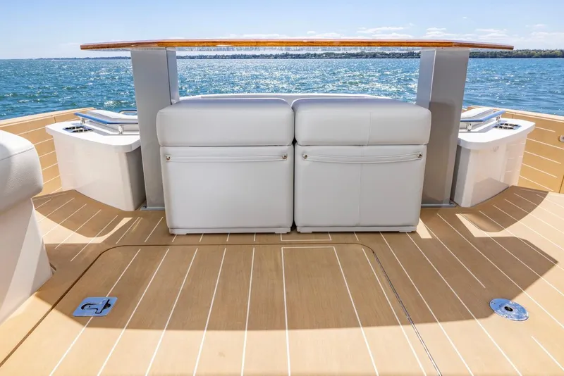 Slide: The Image of 2025 Tiara Yachts EX 54 deck with seating and ocean view. - 19