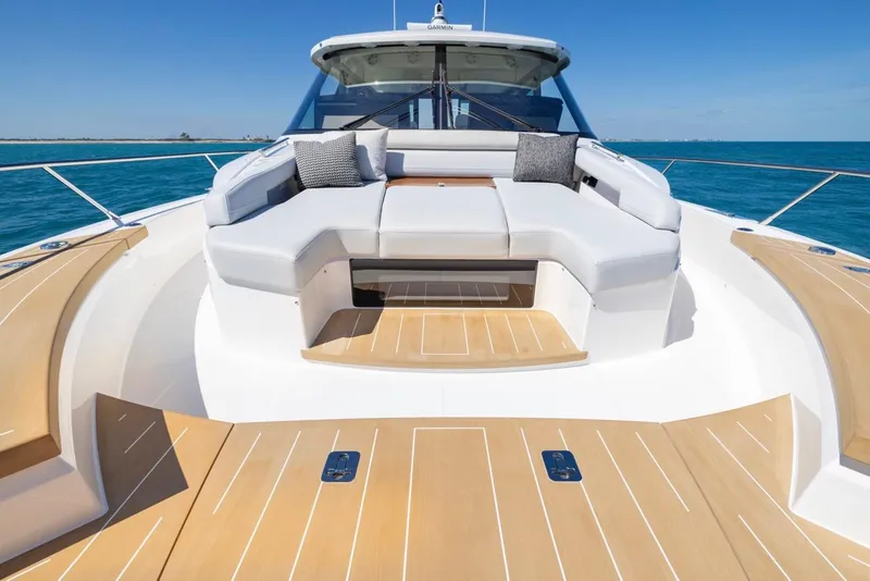 Slide: The Image of Luxurious 2025 Tiara Yachts EX 54 with spacious deck seating and ocean view. - 24