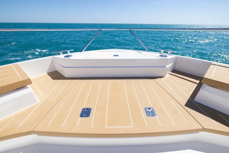 Slide: The Image of Tiara Yachts EX 54, 2025 model, spacious deck overlooking the ocean. - 27