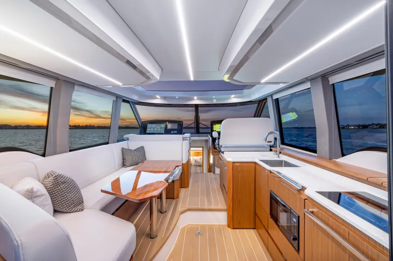 Slide: The Image of Luxurious interior of 2025 Tiara Yachts EX 54 with modern design and sunset view. - 31