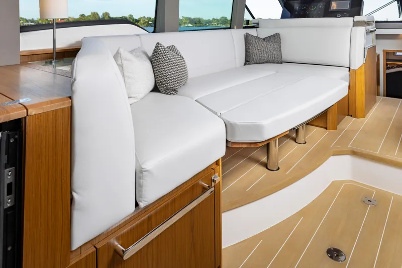 Slide: The Image of Luxurious interior of 2025 Tiara Yachts EX 54 with elegant seating and wooden accents. - 32