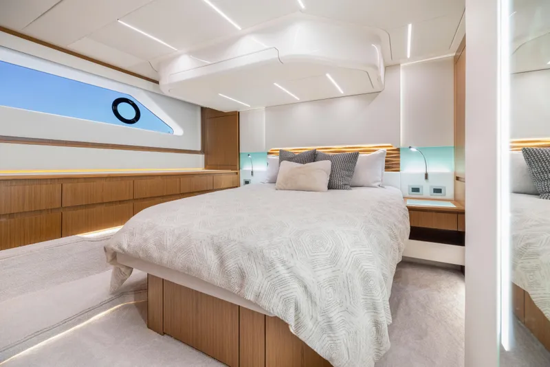 Slide: The Image of Luxurious bedroom interior of 2025 Tiara Yachts EX 54 with modern design and elegant lighting. - 36