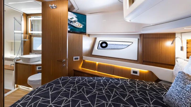 Slide: The Image of Luxurious interior of 2025 Tiara Yachts EX 54, featuring modern design and elegant wood finishes. - 43