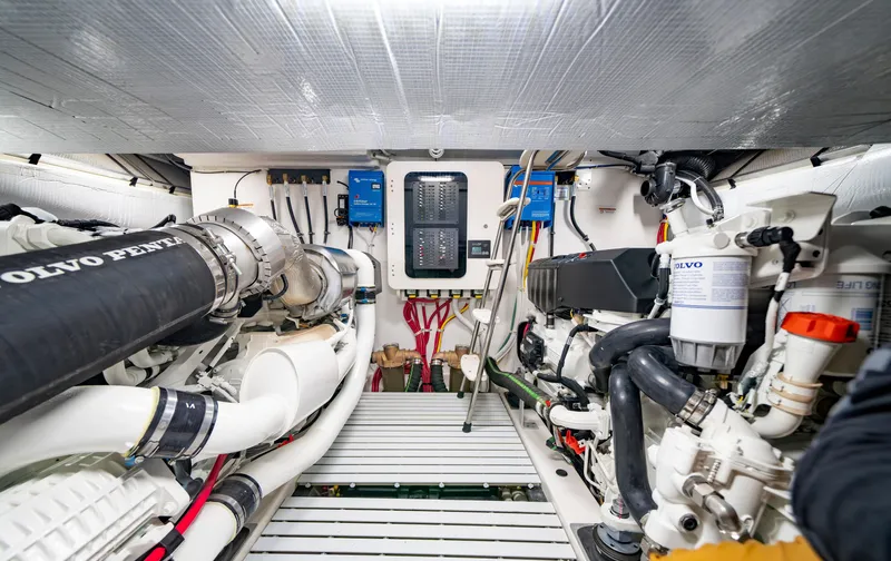 Slide: The Image of Engine room of 2025 Tiara Yachts EX 54, featuring advanced mechanical systems. - 48