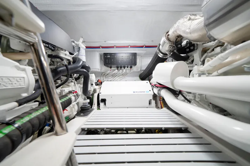 Slide: The Image of Engine room of 2025 Tiara Yachts EX 54, showcasing advanced mechanical systems. - 49