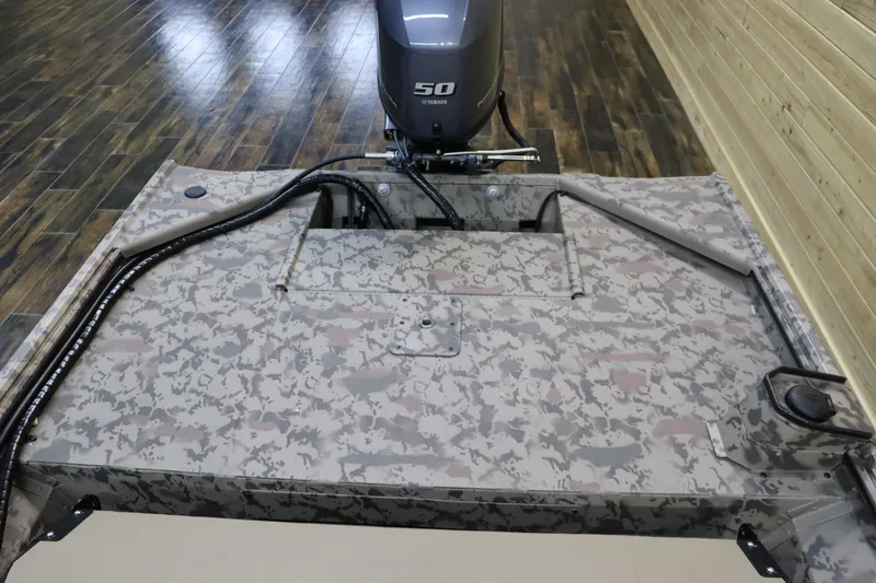 Slide: The Image of 2025 War Eagle 648LDSV boat with camouflage design and 50 HP outboard motor. - 11