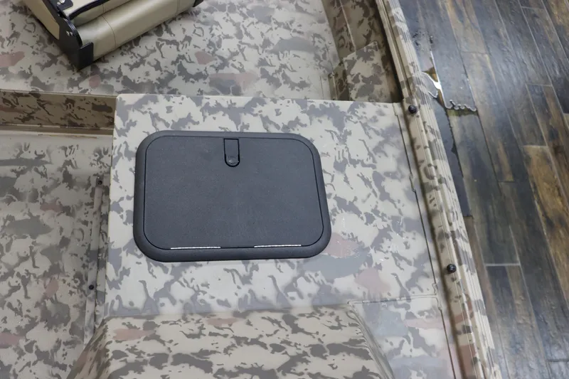 Slide: The Image of 2025 War Eagle 648LDSV boat interior with camouflage design and storage compartment. - 15
