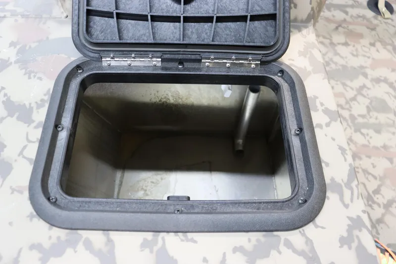 Slide: The Image of Open storage compartment in 2025 War Eagle 648LDSV boat. - 16