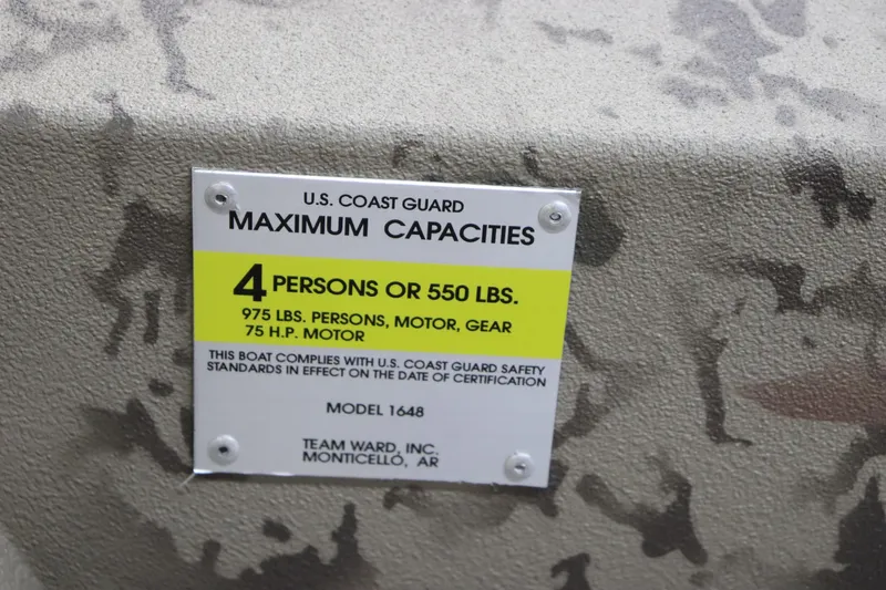 Slide: The Image of War Eagle 648LDSV 2025 boat capacity label, 4 persons or 550 lbs, U.S. Coast Guard compliant. - 18