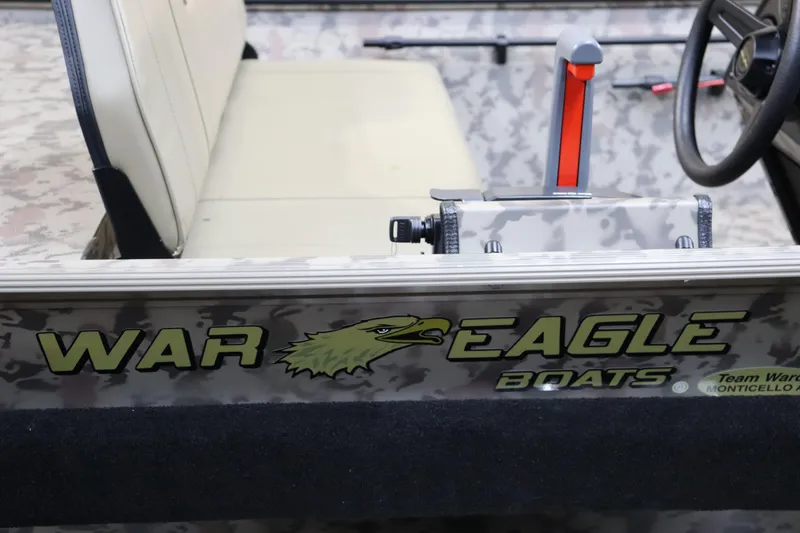 Slide: The Image of 2025 War Eagle 648LDSV boat interior with camouflage design and logo. - 5