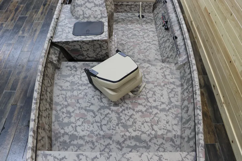 Slide: The Image of 2025 War Eagle 648LDSV boat interior with camouflage design and seating. - 8