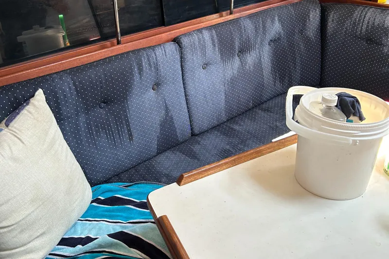 Slide: The Image of Cozy interior of 1988 Catalina mrk.1 with blue seating and table. - 3