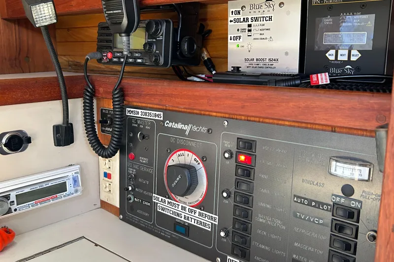 Slide: The Image of Control panel of a 1988 Catalina mrk.1 boat with solar switch and communication devices. - 6