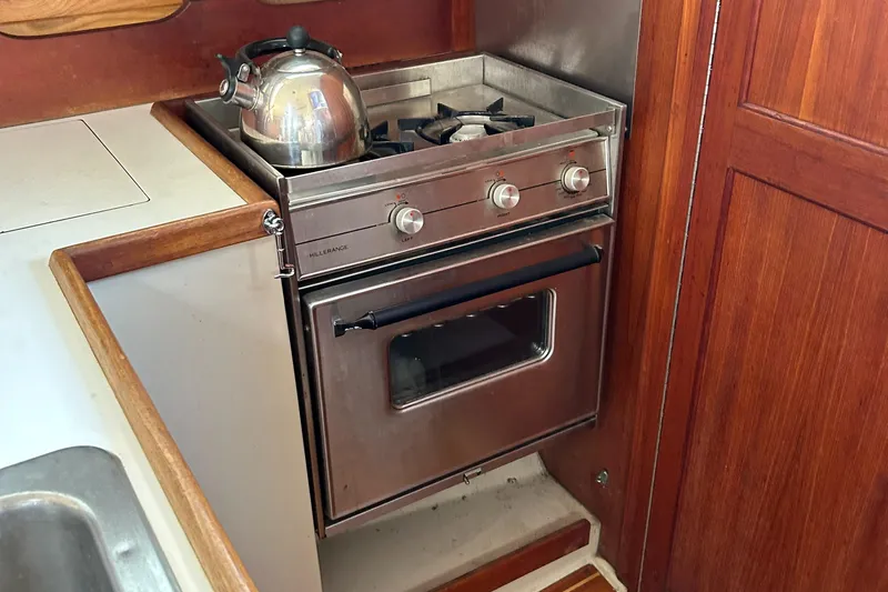 Slide: The Image of Stainless steel stove and oven in 1988 Catalina mrk.1 boat kitchen. - 7