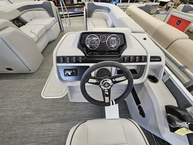 Slide: The Image of 2025 Godfrey Sweetwater 2286 SFL boat interior with modern helm and seating. - 4