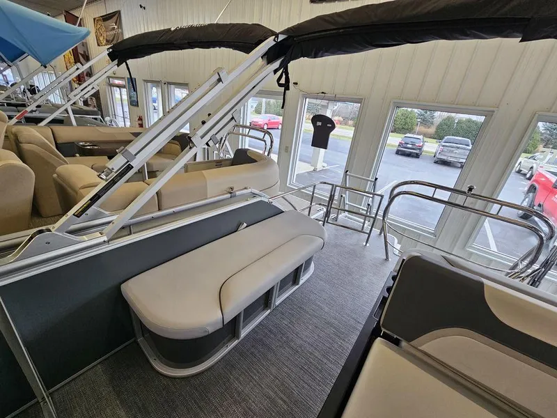 Slide: The Image of 2025 Godfrey Sweetwater 2286 SFL pontoon boat interior with beige seating and modern design. - 5
