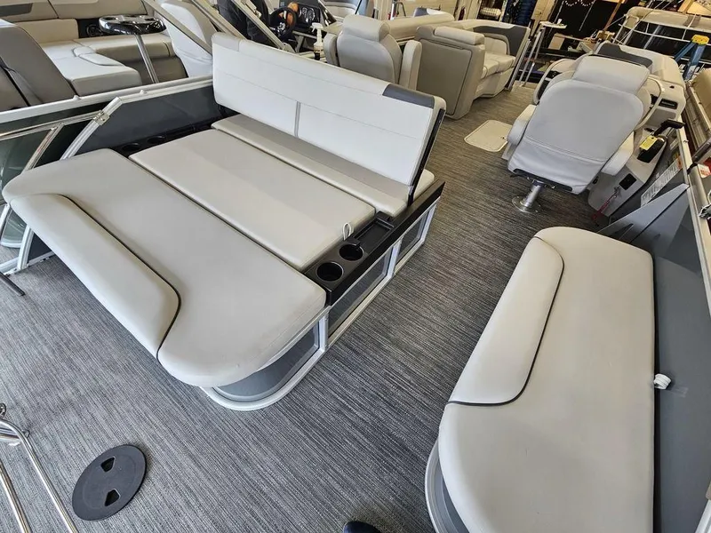 Slide: The Image of 2025 Godfrey Sweetwater 2286 SFL boat interior with plush seating and modern design. - 7