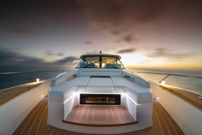 Slide: The Image of Luxurious 2025 Tiara Yachts EX 60 at sunset, showcasing sleek design and elegance. - 16