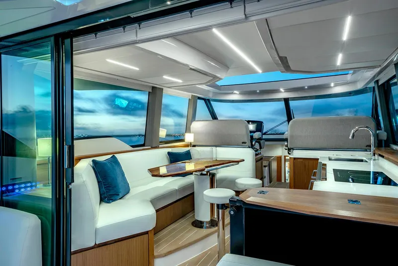 Slide: The Image of Luxurious interior of 2025 Tiara Yachts EX 60 with modern seating and panoramic windows. - 41