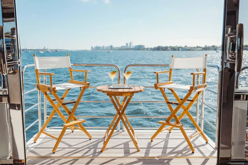 Slide: The Image of Deck view of 2010 Sunseeker 40 Metre Yacht with chairs and drinks. - 10