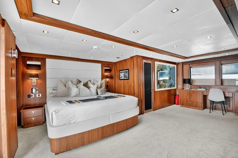 Slide: The Image of Luxurious Sunseeker 40 Metre Yacht 2010 bedroom with elegant wood paneling and modern decor. - 15