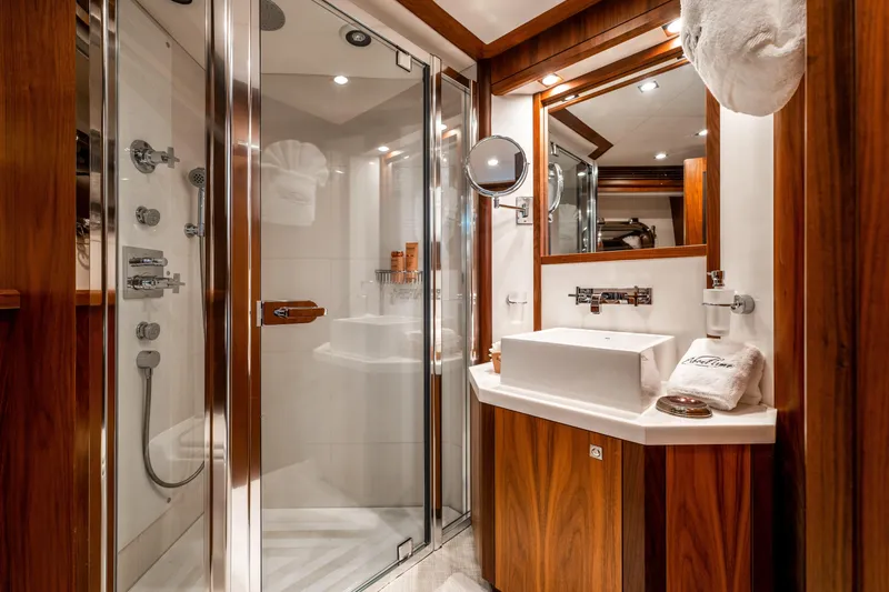 Slide: The Image of Luxurious bathroom on 2010 Sunseeker 40 Metre Yacht with modern fixtures and elegant wood finishes. - 27
