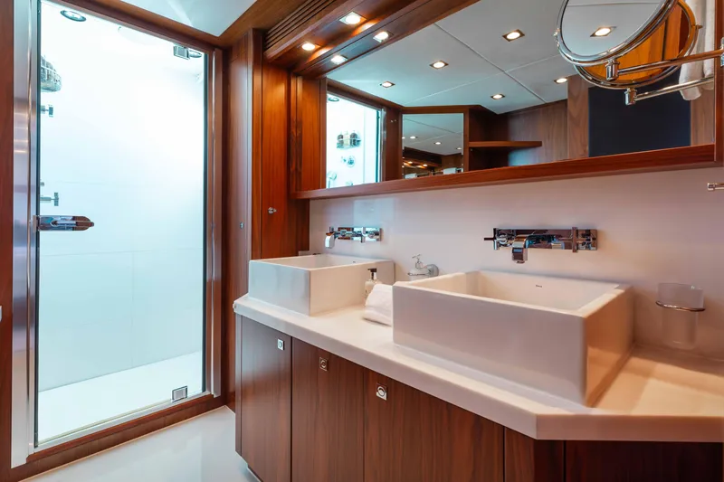 Slide: The Image of Luxurious bathroom on 2010 Sunseeker 40 Metre Yacht with modern fixtures and elegant wood finishes. - 29