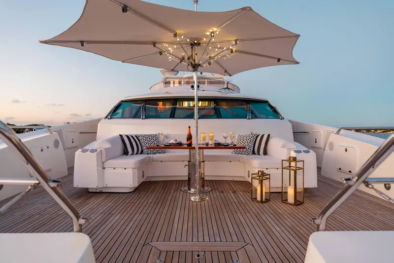 Slide: The Image of Luxurious Sunseeker 40 Metre Yacht deck with elegant seating, umbrella, and ambient lighting, 2010 model. - 44