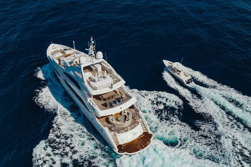 Slide: The Image of Aerial view of 2010 Sunseeker 40 Metre Yacht cruising with a smaller boat nearby. - 47