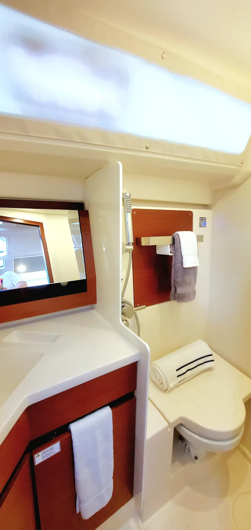 Slide: The Image of 2024 Hanse 388 yacht bathroom with modern fixtures and elegant design. - 21
