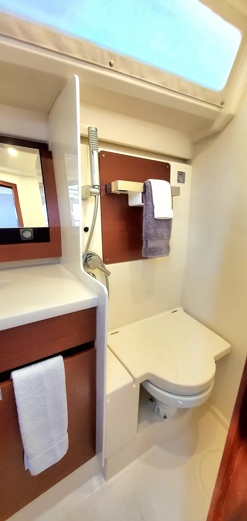 Slide: The Image of 2024 Hanse 388 yacht bathroom with modern fixtures and wooden accents. - 22
