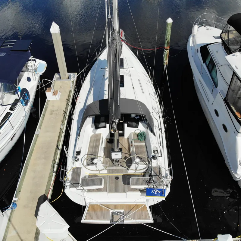 Slide: The Image of Aerial view of 2024 Hanse 388 sailboat docked between yachts. - 32