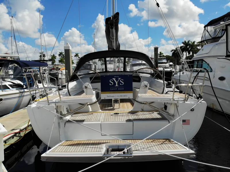 Slide: The Image of 2024 Hanse 388 yacht docked at marina under blue sky. - 38