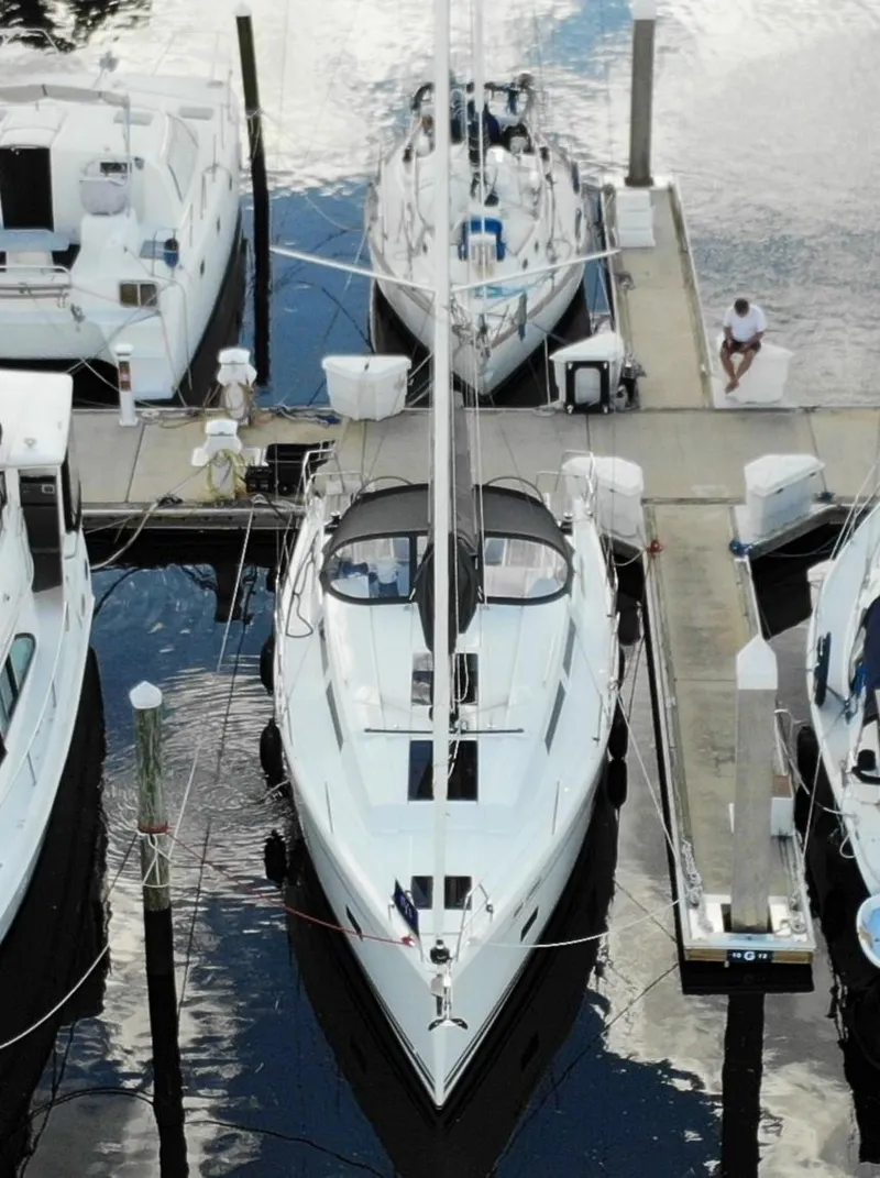 Slide: The Image of 2024 Hanse 388 yacht docked at marina, aerial view. - 5