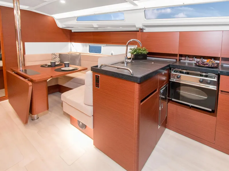 Slide: The Image of Luxurious interior of 2024 Hanse 388 yacht with modern kitchen and dining area. - 9