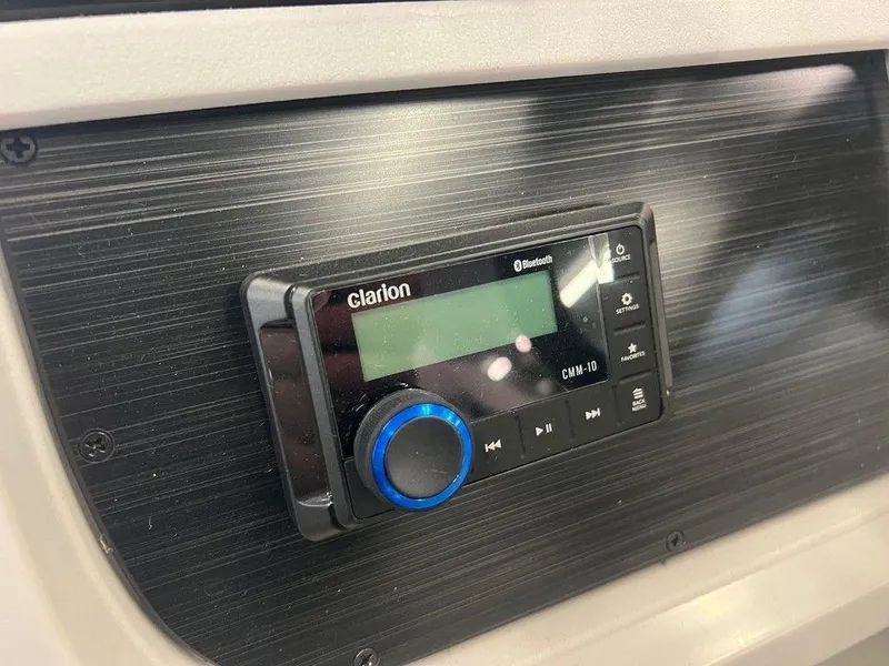 Slide: The Image of Clarion audio system in 2025 Godfrey Sweetwater 2286 SB GTP boat dashboard. - 10