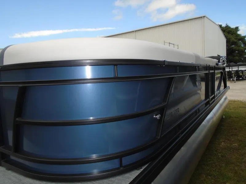 Slide: The Image of 2025 Godfrey Sweetwater 2286 SB GTP pontoon boat with sleek blue exterior. - 12