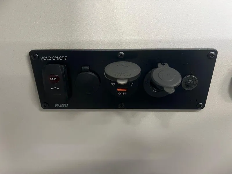 Slide: The Image of Control panel of 2025 Godfrey Sweetwater 2286 SB GTP, featuring switches and dials. - 13