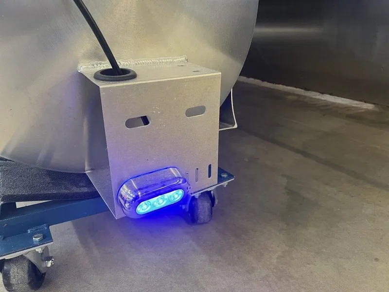 Slide: The Image of 2025 Godfrey Sweetwater 2286 SB GTP boat with blue LED light on metal frame. - 17