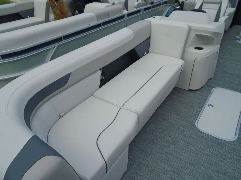 Slide: The Image of 2025 Godfrey Sweetwater 2286 SB boat interior with plush seating and modern design. - 21