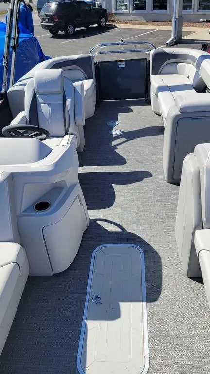 Slide: The Image of 2025 Godfrey Sweetwater 2286 SB pontoon boat interior with spacious seating and modern design. - 23