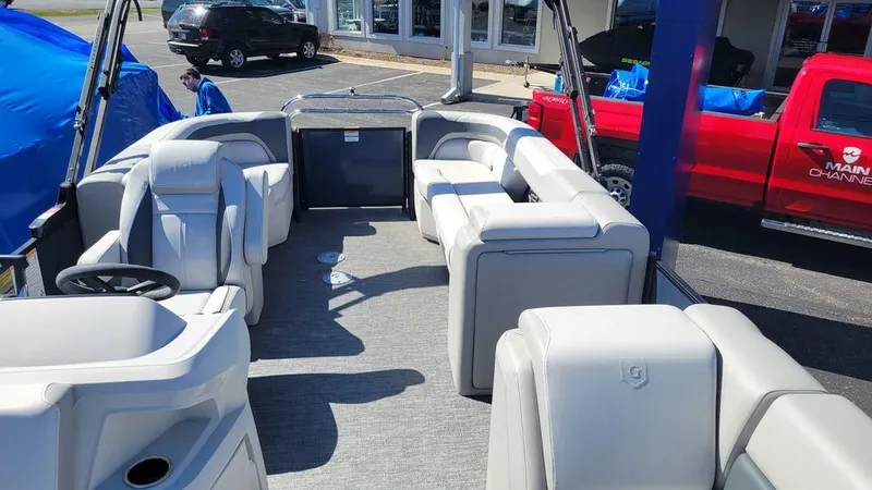 Slide: The Image of 2025 Godfrey Sweetwater 2286 SB pontoon boat interior with plush seating and modern design. - 3