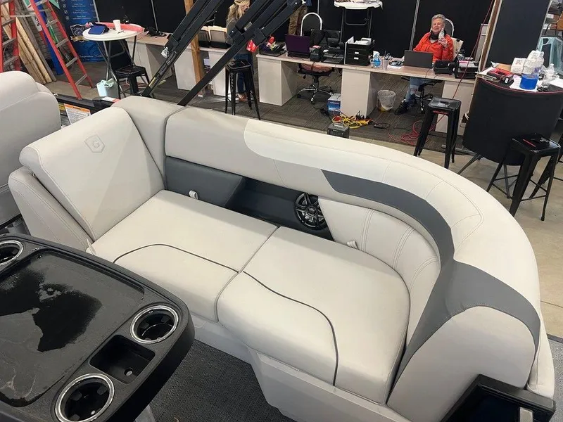 Slide: The Image of 2025 Godfrey Sweetwater 2286 SB GTP boat interior with plush seating and cup holders. - 4