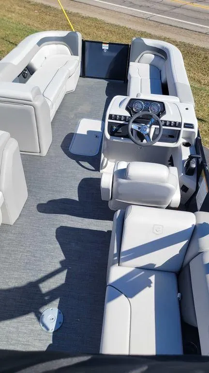 Slide: The Image of 2025 Godfrey Sweetwater 2286 SB GTP pontoon boat interior with modern seating and helm. - 8
