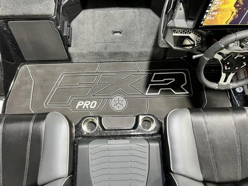 Slide: The Image of 2025 Skeeter FXR20 PRO boat interior with logo and steering wheel. - 1