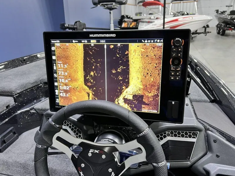 Slide: The Image of 2025 Skeeter FXR20 PRO boat with Humminbird fish finder display. - 10