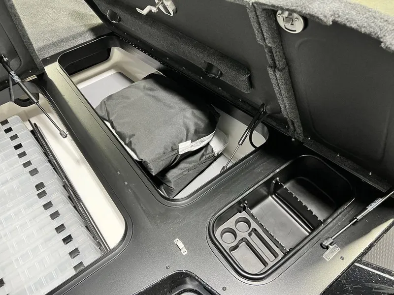 Slide: The Image of 2025 Skeeter FXR20 PRO boat storage compartments with organized interior layout. - 3